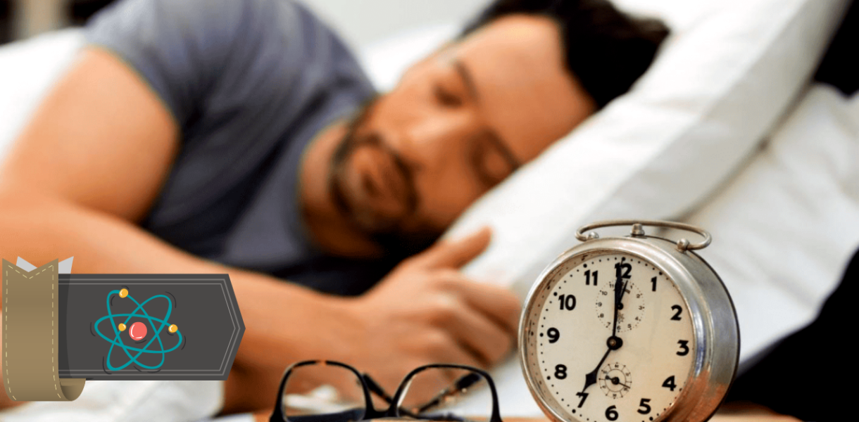 a man sleeping next to an alarm clock following the polyphasic sleep schedule