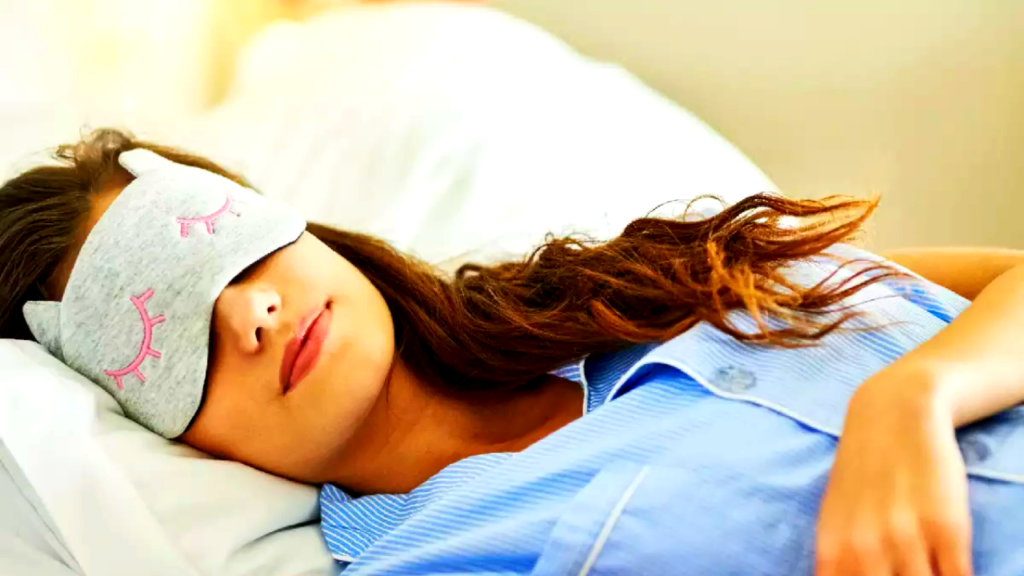a girl napping with a sleeping mask